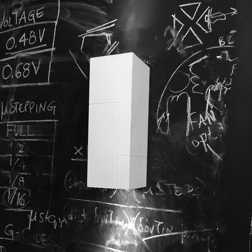 Nama Mondi Up & Down Wall Light installed onto a large chalkboard