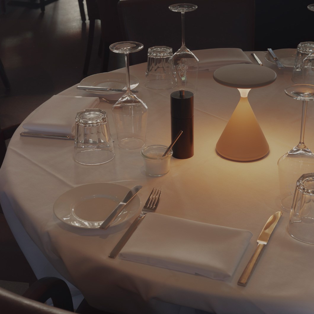 Tobias Grau Salt and Pepper Portable Table Lamp on a restaurant table