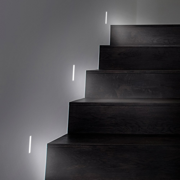 Plaster-In Step Lights & Low Level Lighting: Architectural LED step light plastered into the wall, lighting a staircase