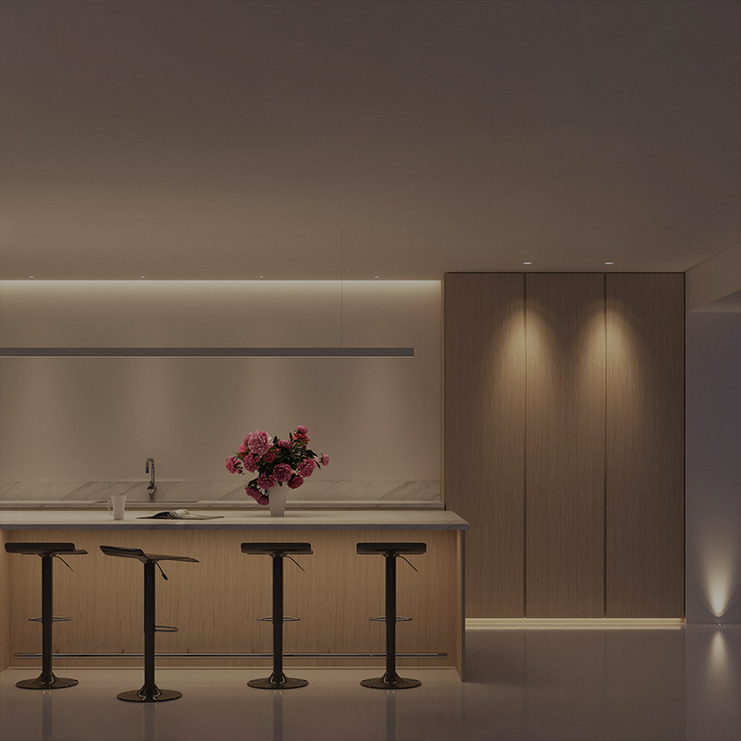Interactive Lighting Design: contemporary kitchen, all lights on - ceiling linear lighting, downlights, breakfast bar light, linear pendant & floor uplight