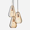 Nuura Anoli 3 trio of pendants with gold glass diffuser on white background