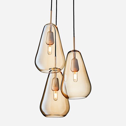 Nuura Anoli 3 trio of pendants with gold glass diffuser on white background
