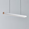The Seed Design Mumu 120 Pendant in white and beech with black suspension cables, lighting over a grey background