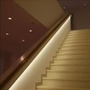 Eleni EL501 linear profile cornice installed as a contemporary handrail for stairs in a modern building