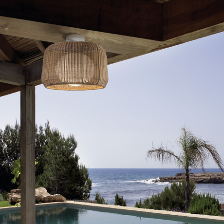 Outdoor LED ceiling light installed at a contemporary property with a pool by the sea