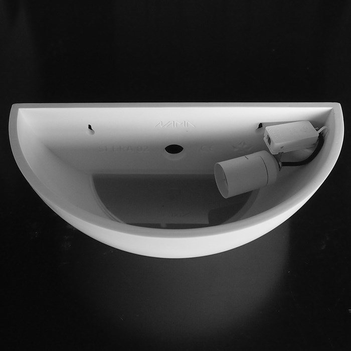 View from above of Nama Sfera 02 up and down wall light showing the inner lamp holder on black background