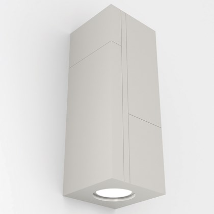 Nama Mondi Up & Down Rectangular Wall Light switched on, set on a grey background