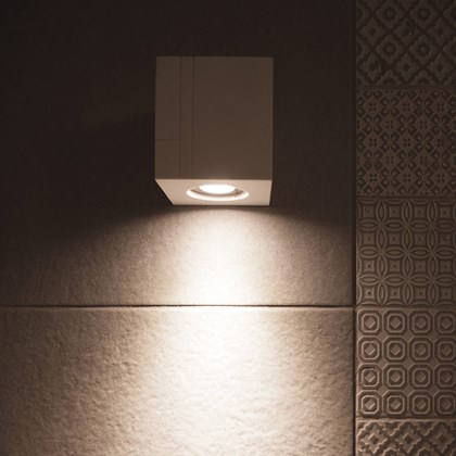 Nama Mondi Down Cube Wall Light switched on, set on a grey background alternative image