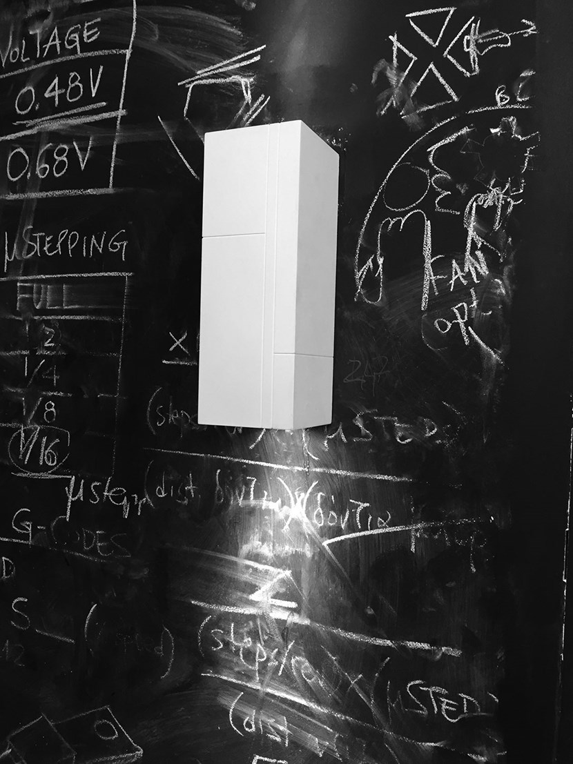 Nama Mondi Up & Down Wall Light installed onto a large chalkboard