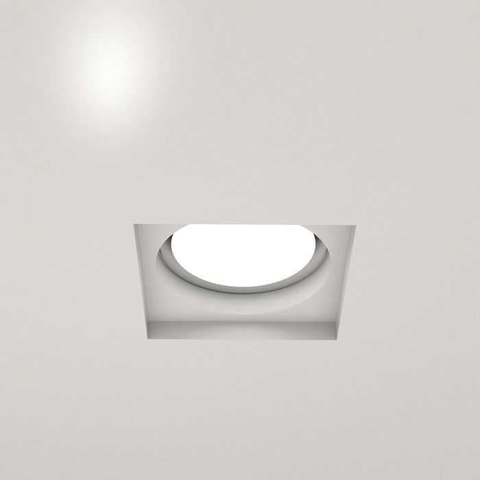 Nama Fos 01 Square Plaster In Downlight with square recess and round light component installed in a grey ceiling & switched on
