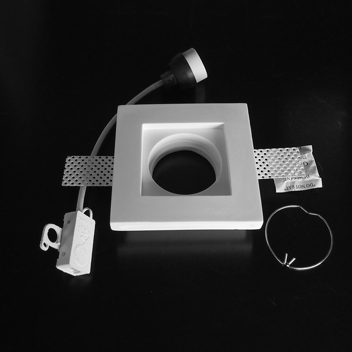 Component frame, lamp holder and fixings of the Nama Fos 01 Square Plaster In Downlight on black background
