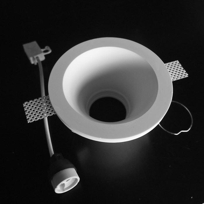 Component frame, lamp holder and fixings of the Nama Fos 03 Round Plaster In Downlight on black background