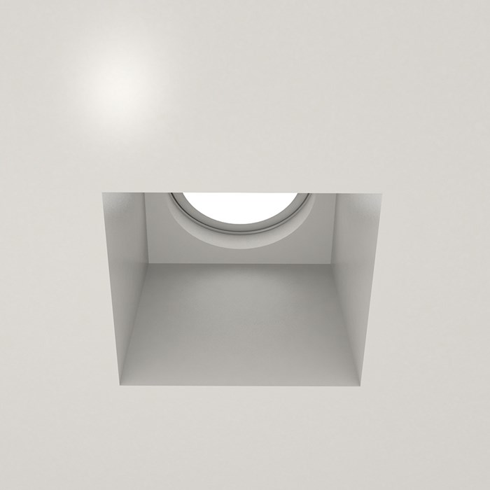 Nama Fos 07 Square Plaster In Downlight installed in a grey ceiling & switched on