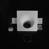 Component frame, lamp holder and fixings of the Nama Fos 10 Round Plaster In Wall Washer Downlight on black background