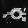 Component frame, lamp holder and fixings of the Nama Fos 16 Round Plaster In Downlight on black background