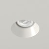 Nama Fos 17 Round Plaster In Downlight installed in a grey ceiling & switched on