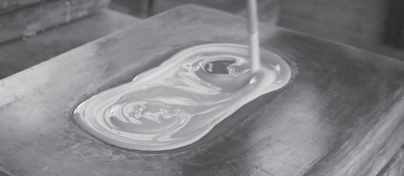 Close up of Nama wet plaster being poured into a cast