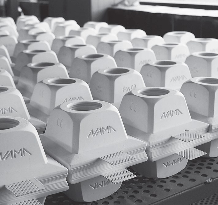 Nama Modular Fos plaster in square frames stacked up on a table in black and white