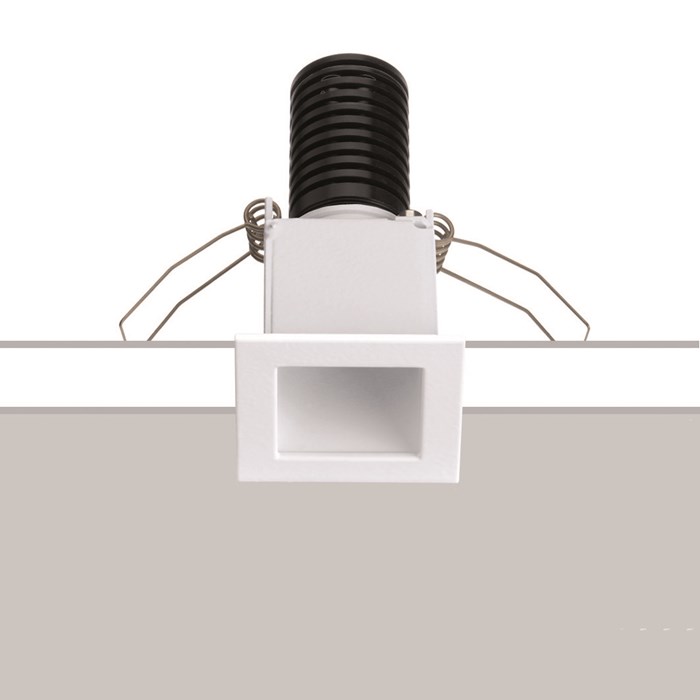 Baba Evo Square Downlight by Flexalighting in a white finish. Stock photo showing installation over a white and grey background.
