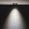 The Flexalighting Jimbo 10 LED Downlight lifestyle image, illuminating a textured wall.
