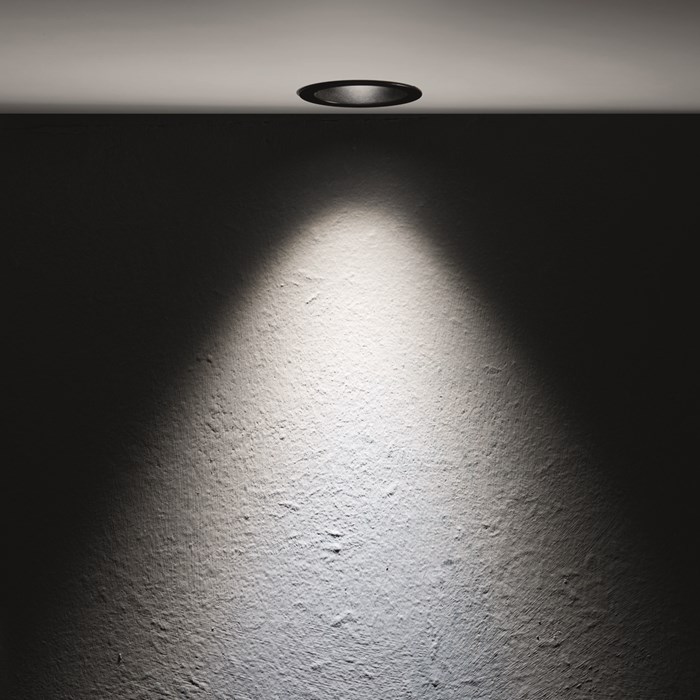 The Flexalighting Jimbo 10 LED Downlight lifestyle image, illuminating a textured wall.