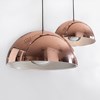 Pair of Seed Design Dome reflective copper pendants in medium & large on grey background