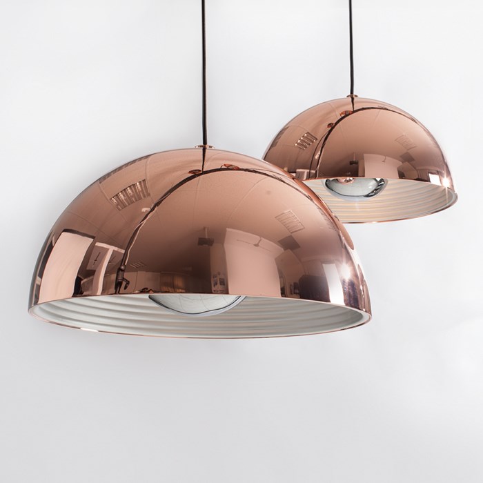 Pair of Seed Design Dome reflective copper pendants in medium & large on grey background