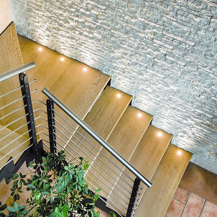 LLD Eco recessed lights, installed as uplighters on steps in a commercial environment.