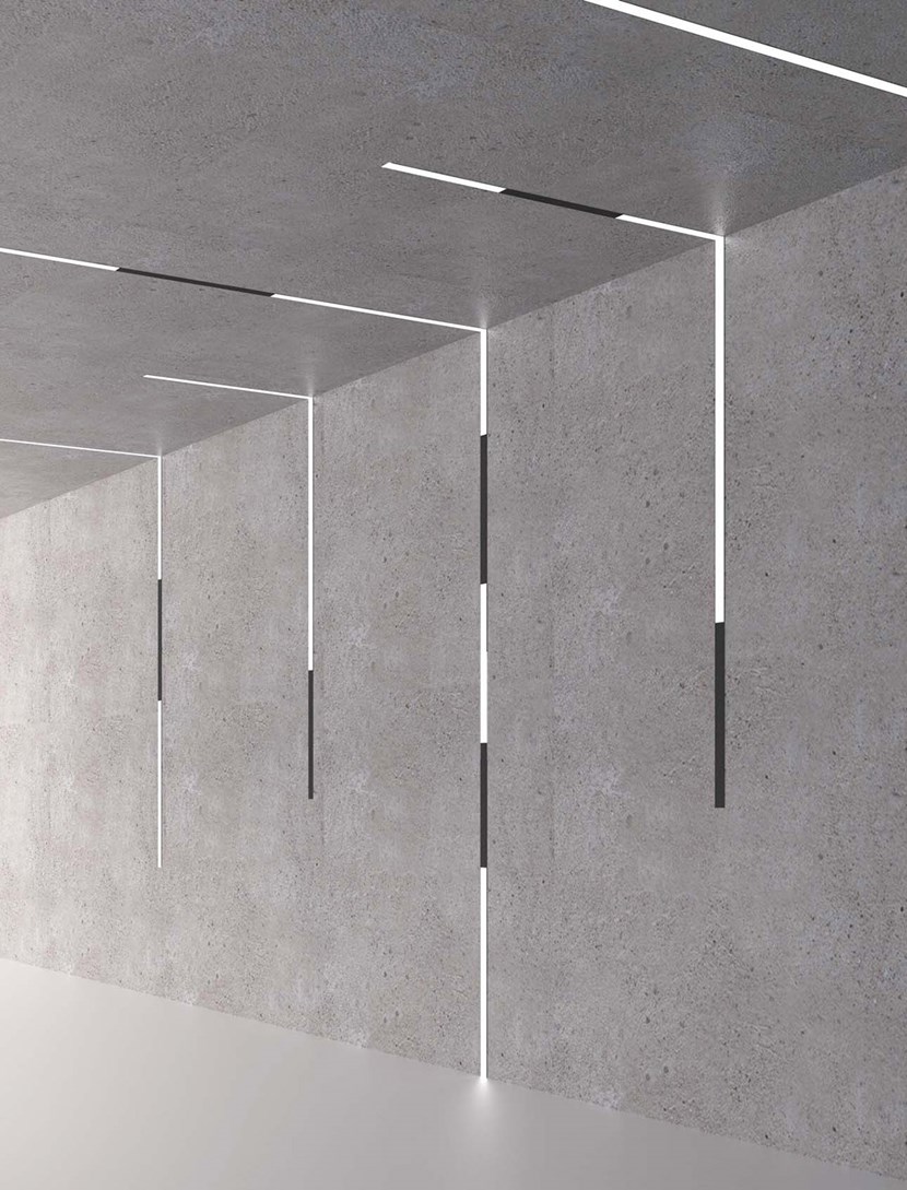 DLD Shadowline recessed track with right angle joint linking from the ceiling to the wall, using linear LED modules