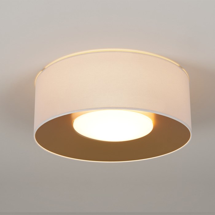 warm white led lid light by Milan Iluminacion finished in white and gold and mounted to the ceiling