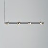 The Olo PL4 Pendant by Seed Design in black and gold with the shades adjusted.