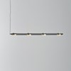 The Seed Design Olo PL4 Pendant by Seed Design in black and gold with the shades all uniform, lighting downwards.