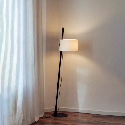 Milan Iluminacion Linood Straight Floor Lamp in oak in a modern living room next to a mid century green fabric sofa alternative image