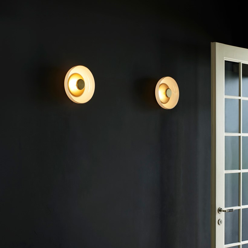 Pair of Nuura Blossi Wall Ceiling Lights in opal white glass lifestyle shot in dark modern interior