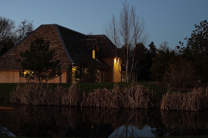 Lighting Design Pickwick side outdoor shot of the garage at night, stream & reeds