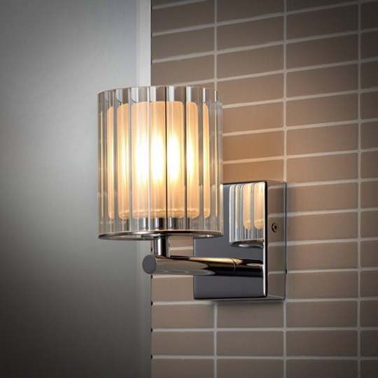 Bathroom Wall Lights: Wall light with glass shade & chrome arm fixed to a contemporary tiled bathroom wall