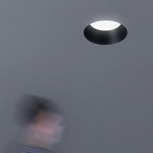 Motion Sensor Lighting: plaster-in trimless downlight switched on by the movement of a person below