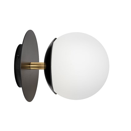 Side shot of circular wall light with white glass globe, black disc, and brass supporting tube shown against white background. 