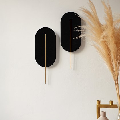 Elongated oval shaped wall light with a rectangular central rod all finished in white alternative image