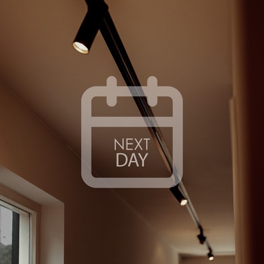 Next Day Delivery: black trimless track installed in a hallway ceiling with 5 minimalist adjustable spotlights