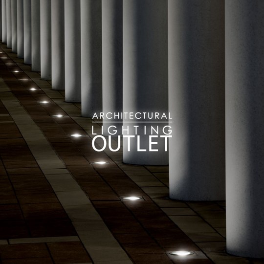 Architectural Lighting Outlet: a row of over 10 floor recessed round uplights shining up a series of columns at night