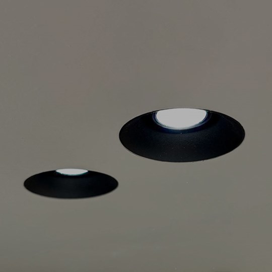 Architectural Lighting: Nebo trimless plaster-in adjustable black downlight installed in a ceiling