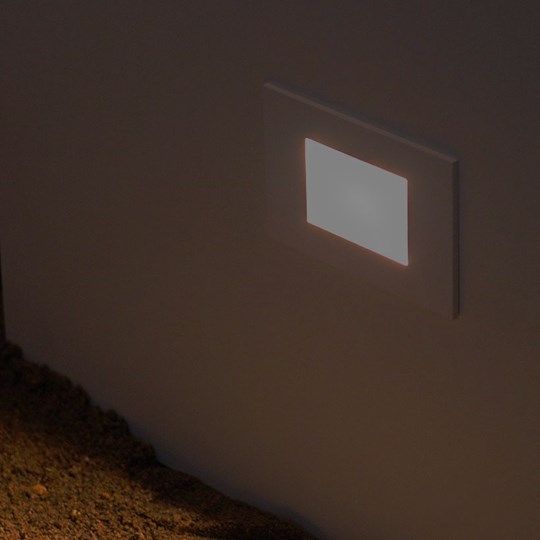 Outdoor Lighting: rectangular wall recessed low level step or path light, lighting the earth below 