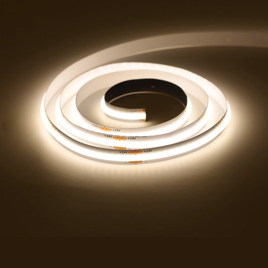 Next Day Delivery: roll of LED tape illuminating a dark background with warm white light
