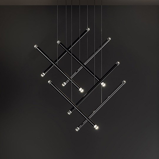 Indoor Lighting: Cluster of minimal tubular pendants arranged in a geometric formation against a black backdrop