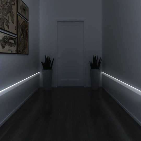 Architectural Lighting: plaster-in linear LED profile offering low level light in a modern hallway with wood floor