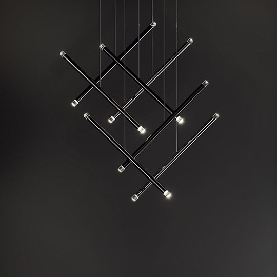 Indoor Lighting: Cluster of minimal tubular pendants arranged in a geometric formation against a black backdrop